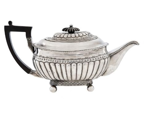 A George III silver teapot, of reeded oblong shape with domed lid, on ball feet, 14cm h, by Emmanuel Levy, Exeter 1810, 17ozs