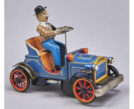 A&nbsp; Japanese lithographed tinplate and battery and friction powered veteran motor car and driver toy&nbsp; Yonegawa, 1960