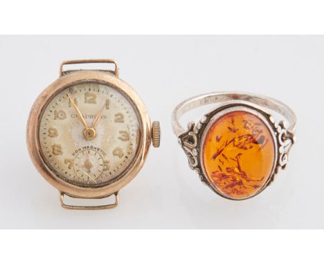 An amber ring, in silver, 4.2g, size S and a 9ct gold lady's wristwatch, 7.6g (2) Condition evident from image, i.e typical w