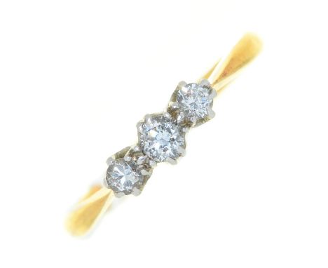 A three stone diamond ring, gold hoop marked 18ct PLAT, 1.9g, size L Slight distortion