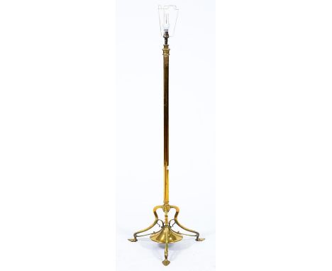 An Edwardian telescopic brass oil lamp standard, on art nouveau style legs, converted to electricity, lacks fitment, telescop