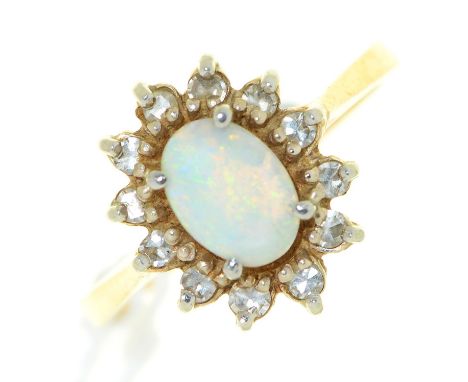 An opal and diamond cluster ring, in gold, marked 14, 2.5g, size I½ Opal slightly scratched