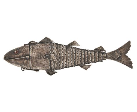 A Continental silver model of a fish, c1900, fully articulated, the head with red enamel eyes and hinged to form a compartmen