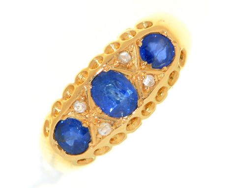 A sapphire and diamond ring, in 18ct gold, Birmingham 1915, 2.5g, size K Centre stone slightly scratched.  One of the two sma