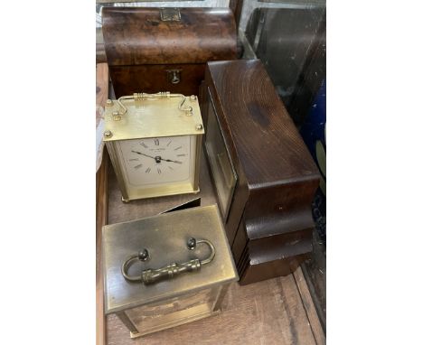 A walnut tea caddy, with a domed top together with a mantle clock and two carriage clocks