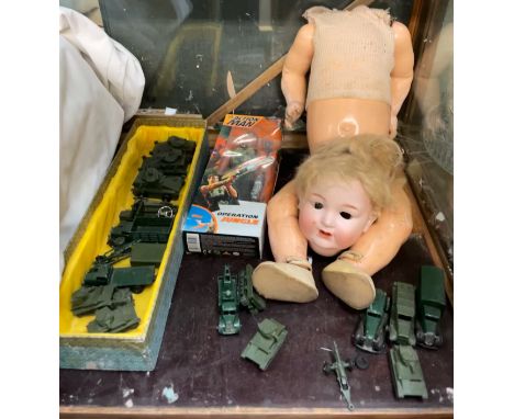 A Hugo Wiegand bisque head doll, with a composition body, together with a boxed action man figure and a collection of Dinky m
