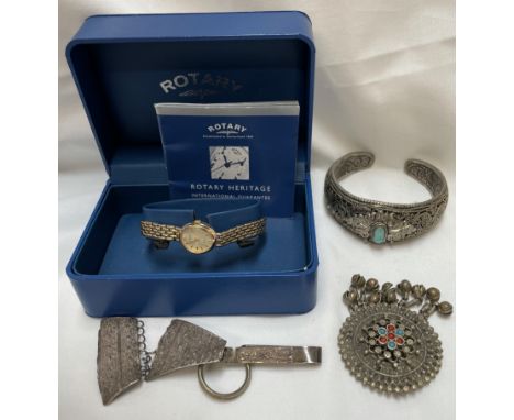 A lady's 9ct yellow gold Rotary Elite wristwatch, boxed together with white metal jewellery