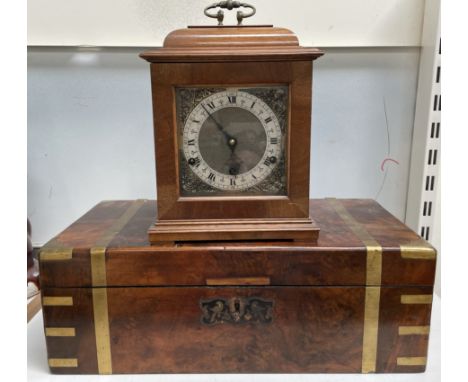 A Victorian walnut writing slope together with a walnut mantle clock