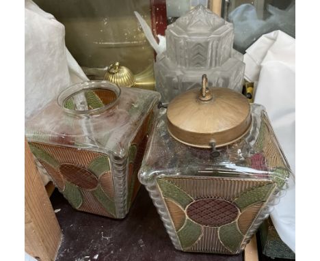 A pair of Art Deco style coloured glass lamp shades together with another lamp shade