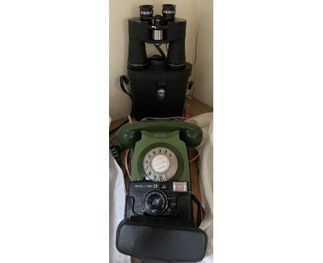 A green bakelite telephone, chinon binoculars and a Konica camera
