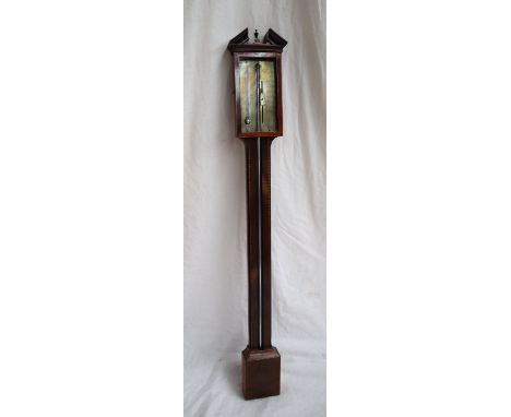A 19th century mahogany stick barometer, with an architectural pediment above a chequer banded column, the silvered dial insc