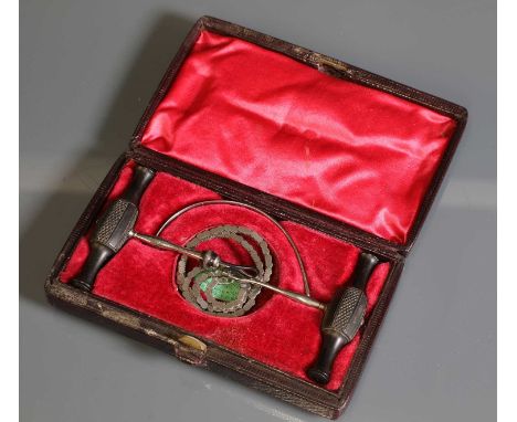 A medical chainsaw,mid-19th century, made by Coxeter, London, both ebony handles stamped 'Coxeter', in its original box with 