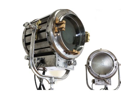 A near pair of Klieg-style studio lamps, mid-20th century, each mounted on a tripod, one example with brass mounts, 28cm wide