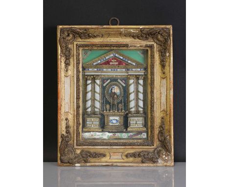 A scratch-built shadowbox reliquary,19th century, likely Italian, constructed as an altar with brass and paper filigree work,