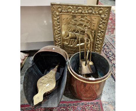 Brass firescreen, a copper coal helmet, a pair of bellows, a companion set and a copper bucket