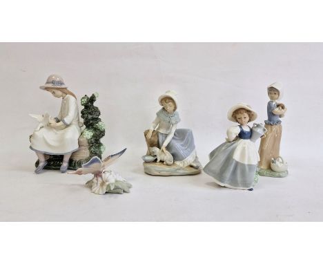 Nao figure of girl seated with doves, another girl with kitten, two other Nao girl figures and a Lladro model butterfly on fl