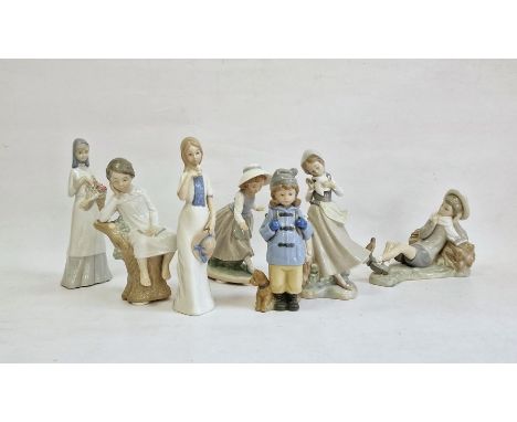 Lladro figure of girl with doves, a Lladro boy reclining with bird, another Lladro figure of boy in nightgown, two Nao figure