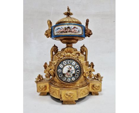19th century French ormolu and porcelain mantel clock with striking movement&nbsp;,with foliate finial above gadrooned porcel