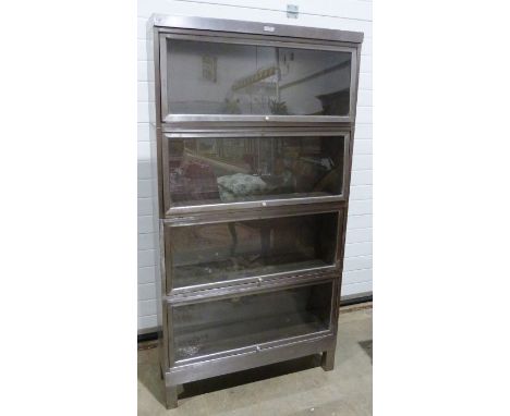 Four-section sectional bookcase in stainless brushed steel, in Globe Wernicke-manner, marked 'The General Fireproofing Co You