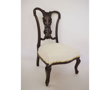 Victorian bedroom chair in Chippendale style, with carved back, on cabriole front legs