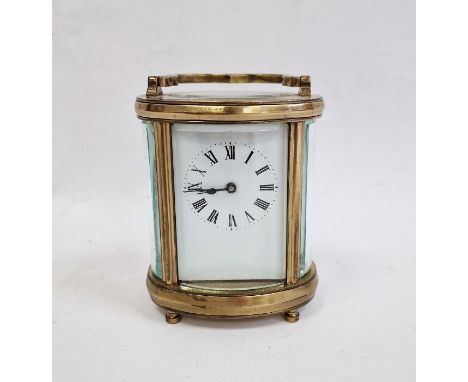 20th century brass and glass carriage clock with oval body, Roman numerals to the dial, 11cm high 