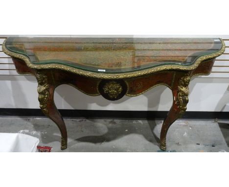 19th century boullework console table with tortoiseshell and brass inlay top to the serpentine front, with brass egg and leaf