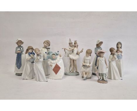 Lladro figure group ballerina and clown, two Nao girls with puppies, Nao girl seated with blackboard and a Nao child dressed 