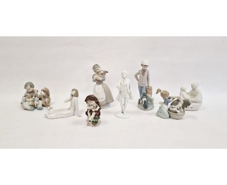 Lladro porcelain group of child seated with dog and puppies, Lladro figure of a girl grooming a dog, three various Lladro and