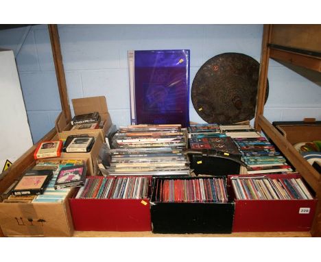 A shelf of Dr Who annuals, novels, DVDS and tapes etc.