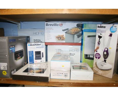 A shelf of miscellaneous; professional fryer, steam cleaner etc. (boxed)