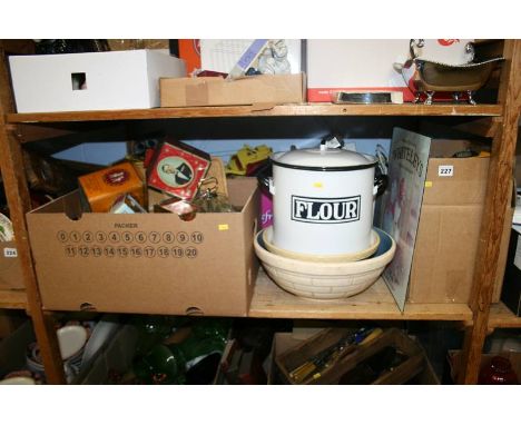 A shelf of miscellaneous, decorative tins etc.