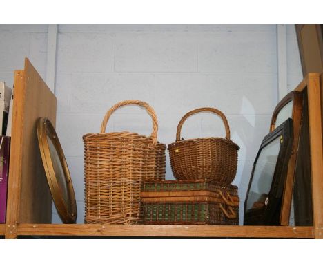 A shelf of mirrors, wicker baskets etc.