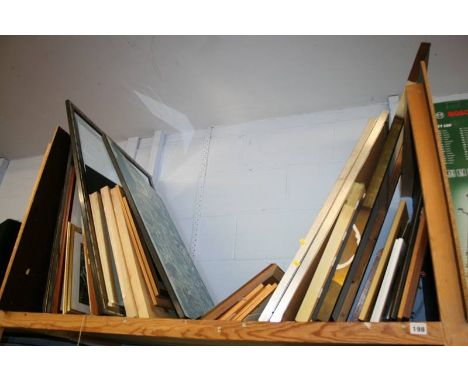 A shelf of framed pictures and prints