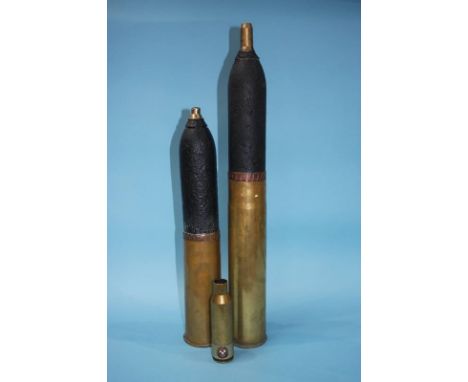 Three brass ordnance shells