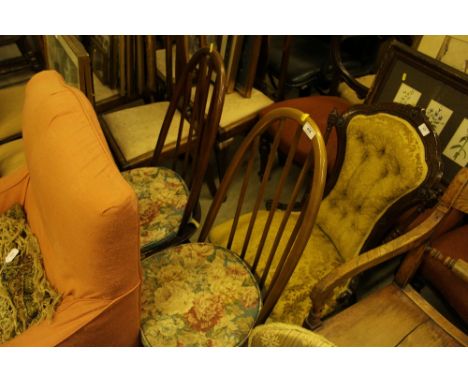 A pair of Ercol stick back kitchen chairs 