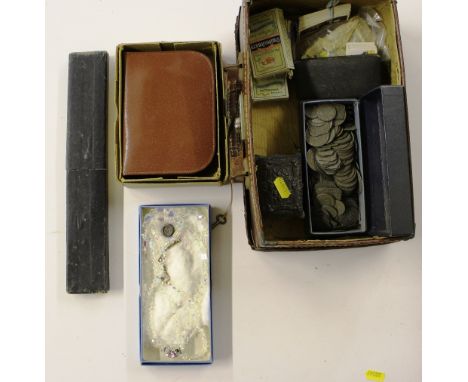 A brown leather case containing cigarette cards; a small pewter box; a costume necklace; a slide rule; vanity set etc. 
