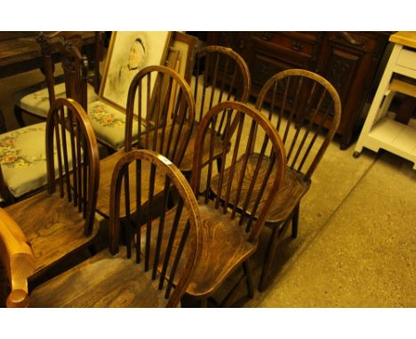 A set of six elm seated stick back kitchen chairs 