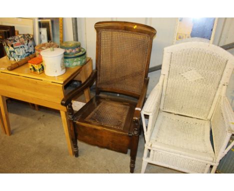 A cane seated commode chair 