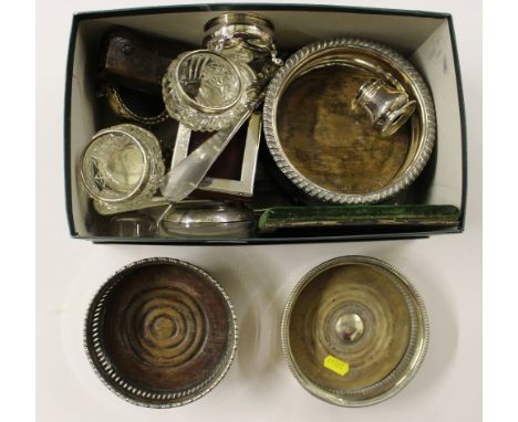 A box containing various silver and plated ware to include a silver handled shoe horn and button hook, silver plated salts an