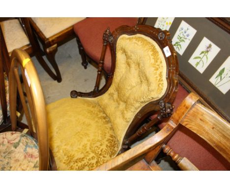 A Victorian walnut button back nursing chair