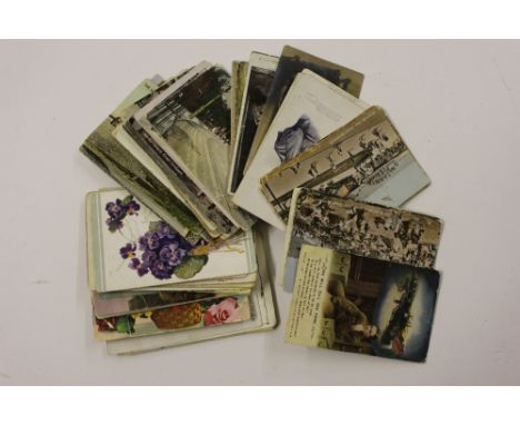 A quantity of various post-cards and stamps on pages