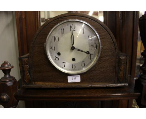 A 20th Century oak three hole mantel clock 
