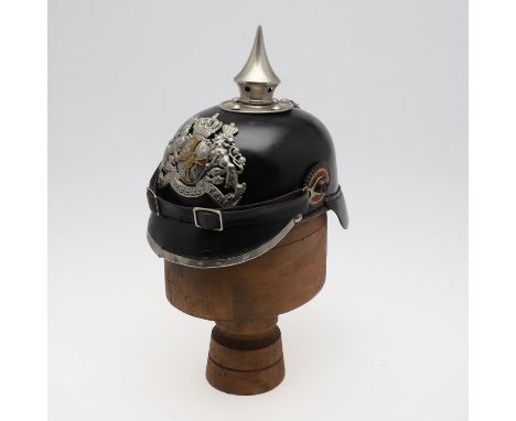 A Pre- First World War Bavarian pickelhaube with raised spike, the mount with four domed fixings, the helmet plate with Bavar