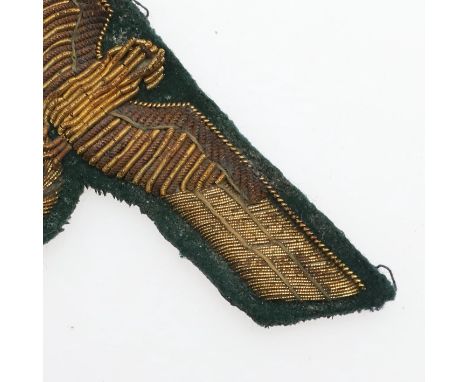 A German Army General's breast eagle, gold bullion wire on a dark green felt backing. 9.5 x 4cm   *Condition:  Possibly remov