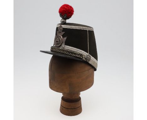 An Edwardian black cloth Shako with silver bullion bands to the body, the chin-chain with twin fixing points, the point rear 