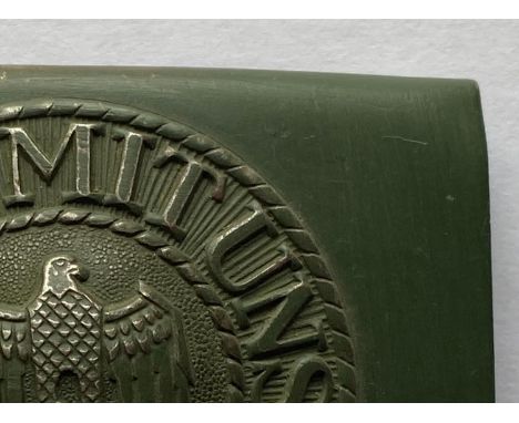 A Second World War German Army Belt buckle, a wartime steel example with an Eagle in center, &amp; 'Gott mit uns' motto aroun