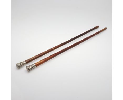 A silver topped walking cane decorated with 'Bays' within a laurel wreath and beneath a crown, all within scrolling foliate d
