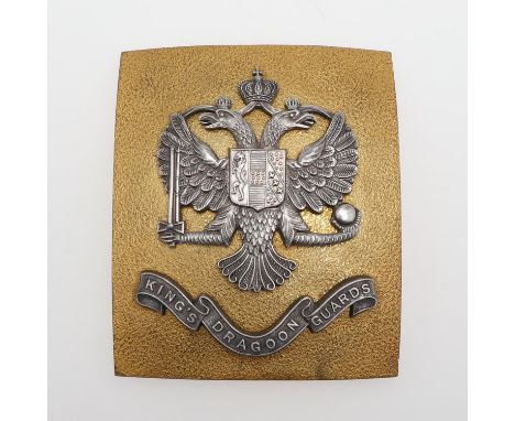 A convex brass belt plate mounted with double headed eagle and 'king's Dragoon Guards' probably for a post Second World War S