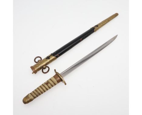 A Second World War Japanese Naval Officers Dagger with a 21cm pointed blade with fuller, the gilt wire wound handle with shag