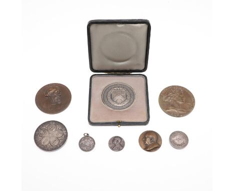 A collection of medals including: A Worshipful Company of Stationers Examination Prize Medal awarded in 1927, in case of issu
